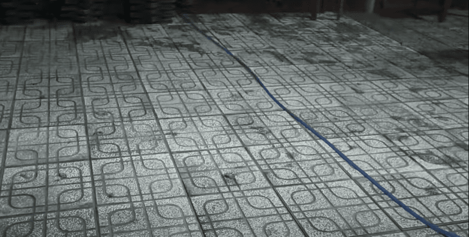 A picture containing floor, paving
Description automatically generated